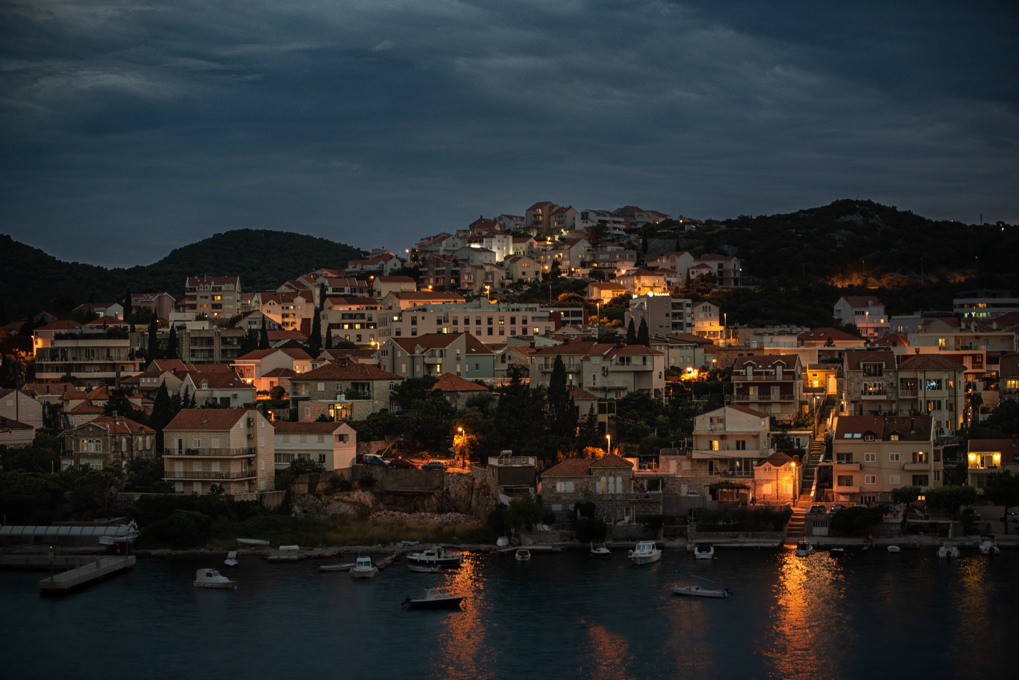 Coastal village illuminated at blue hour