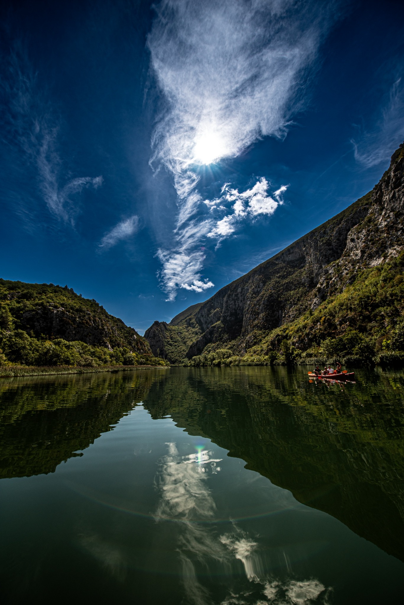 Mountain lake reflecting a dramatic sky
